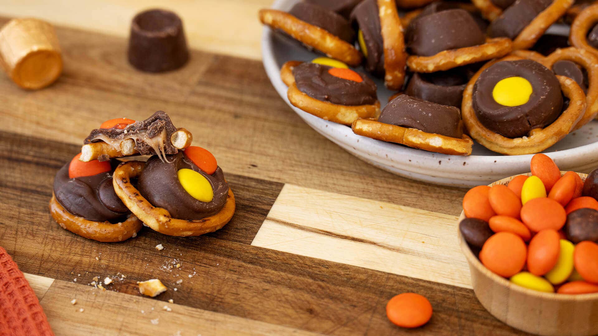 plate of rolo pretzel delights topped with reeses pieces candy
